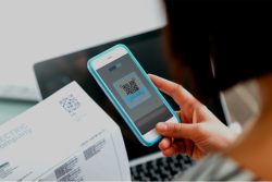 A close-up of a phone - Streamline Heating and Air A person with their hands on a phone