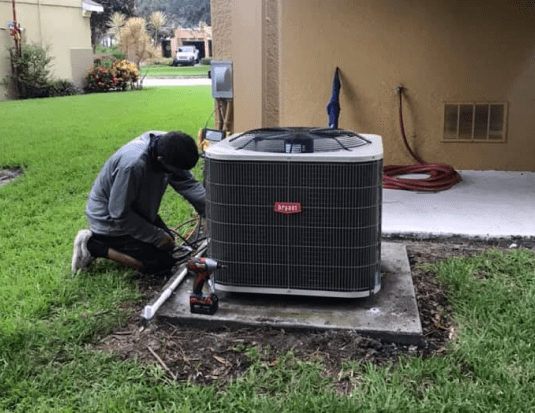 HVAC being repaired by a technician