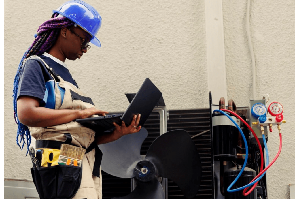 Worker doing air conditioner inspection