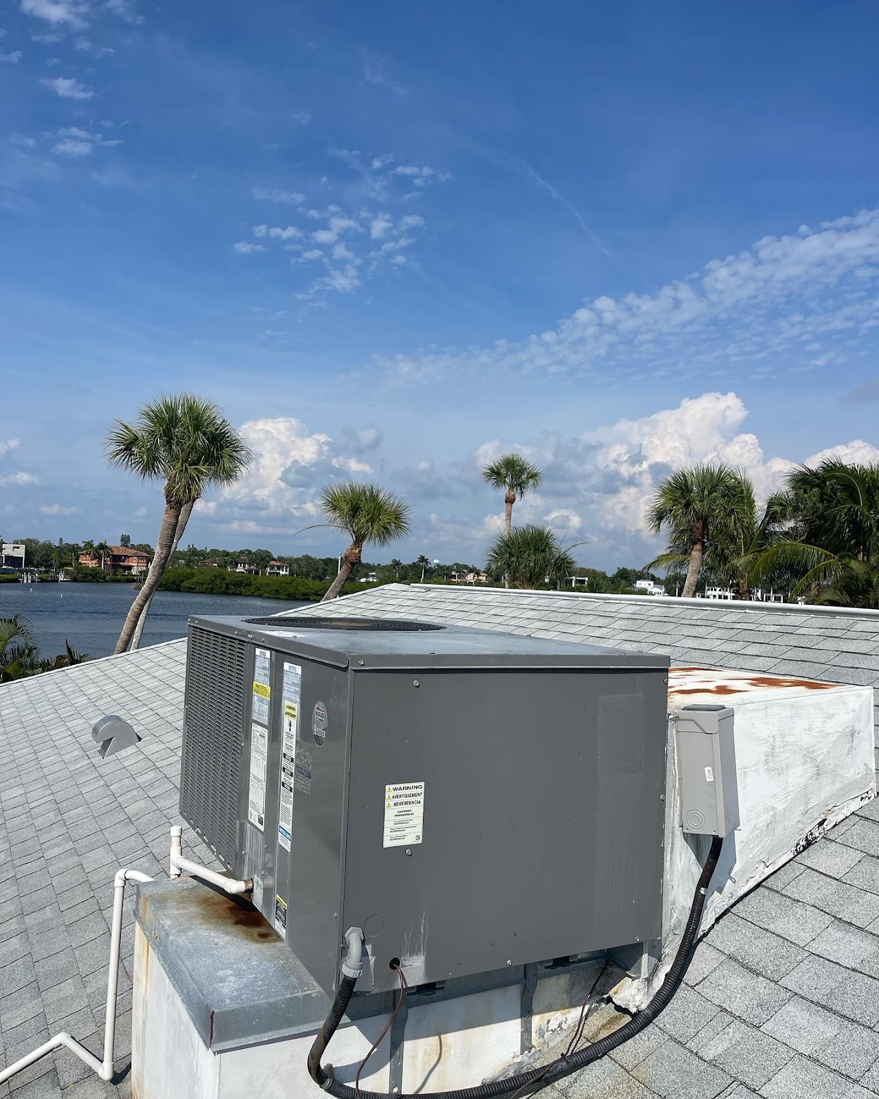 A picture of an air conditioner unit on a roof