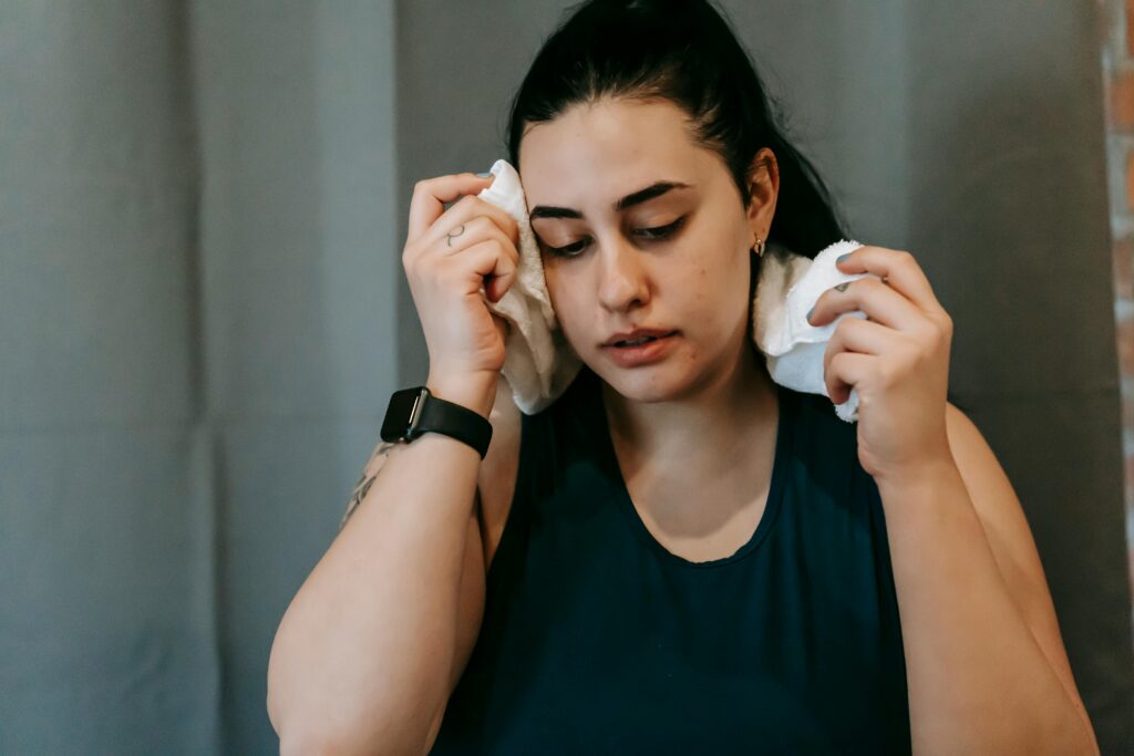 A picture of a person with a towel around her neck