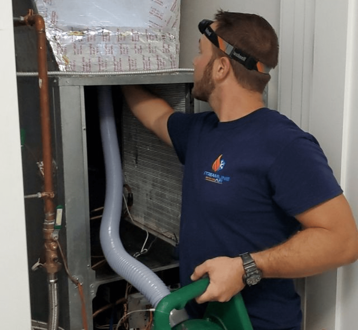 A picture of an HVAC repair person